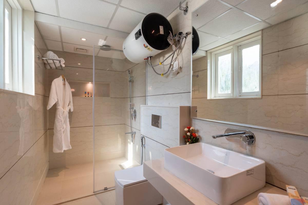 Modern attached bathroom with vessel sink