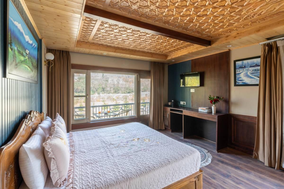 Sunlit bedroom with large windows