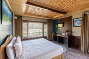 Sunlit bedroom with large windows