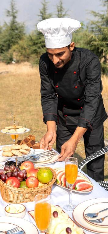 Chef at work serving a meal at Khwab Villa